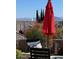 Relaxing patio with red umbrella and mountain views at 15959 E Brodiea Dr, Fountain Hills, AZ 85268