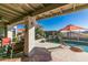 Covered patio overlooking a refreshing pool and tranquil landscape at 15959 E Brodiea Dr, Fountain Hills, AZ 85268