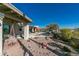 Serene backyard with a pool, patio seating, and a calming rock garden at 15959 E Brodiea Dr, Fountain Hills, AZ 85268