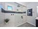 Spa-like bathroom with walk-in shower, double vanity, and gray tile floors at 16871 W Cielo Grande Ave, Surprise, AZ 85387