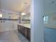 Modern bathroom with double vanity, large shower and grey tile floor at 16871 W Cielo Grande Ave, Surprise, AZ 85387