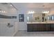 Elegant bathroom with double vanity, large shower, and modern fixtures at 16871 W Cielo Grande Ave, Surprise, AZ 85387