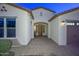 Inviting entryway with tile flooring and a built-in bench at 16871 W Cielo Grande Ave, Surprise, AZ 85387