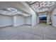 Extravagant garage with hexagon LED lighting and epoxy flooring at 16871 W Cielo Grande Ave, Surprise, AZ 85387