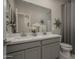 Modern bathroom with dual vanity and updated fixtures at 17058 W Seldon Ln, Waddell, AZ 85355