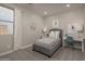 Cozy bedroom featuring a twin bed and a workspace at 17058 W Seldon Ln, Waddell, AZ 85355