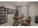 Home office with rustic wooden desk and industrial shelving at 17058 W Seldon Ln, Waddell, AZ 85355