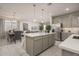 Modern kitchen with gray cabinets, white countertops, and an island at 17058 W Seldon Ln, Waddell, AZ 85355