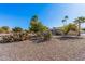 Landscaped backyard featuring drought-tolerant plants and gravel at 18014 N Broken Bow Ct, Sun City, AZ 85373