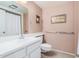 Clean bathroom with a single sink vanity and shower/tub combo at 18014 N Broken Bow Ct, Sun City, AZ 85373