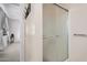 Bathroom features a shower stall with frosted glass door at 18014 N Broken Bow Ct, Sun City, AZ 85373