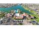 Aerial view of community with lake, clubhouse, and pool at 18055 W Muirwood Dr, Goodyear, AZ 85338