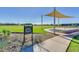 Community bandstand with shade structure and landscaped area at 18055 W Muirwood Dr, Goodyear, AZ 85338