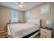 Bright bedroom with white furniture and plantation shutters at 18055 W Muirwood Dr, Goodyear, AZ 85338