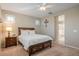 Spacious bedroom with wood furniture and a view of the bathroom at 18055 W Muirwood Dr, Goodyear, AZ 85338