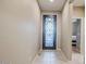 Bright entryway with tiled floors and an ornate front door at 18055 W Muirwood Dr, Goodyear, AZ 85338