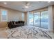 Gathering room with sliding glass doors leading to the backyard at 18055 W Muirwood Dr, Goodyear, AZ 85338