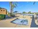 Community hot tub with chairs and shade at 18055 W Muirwood Dr, Goodyear, AZ 85338