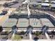 Aerial view of residents playing on pickleball courts at 18055 W Muirwood Dr, Goodyear, AZ 85338