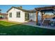 Relaxing backyard patio with pergola, seating area, and lush landscaping at 1860 S 24Th St, Mesa, AZ 85204