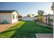 Landscaped backyard with grassy area and play structure at 1860 S 24Th St, Mesa, AZ 85204