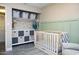 Bedroom with crib, closet, and built-in storage solutions at 1860 S 24Th St, Mesa, AZ 85204