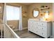 Bedroom featuring a dresser, changing pad, and ample storage at 1860 S 24Th St, Mesa, AZ 85204