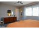 Bedroom with mid-century modern dresser and large windows at 1860 S 24Th St, Mesa, AZ 85204