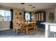 Bright dining room featuring a wooden table and bench at 1860 S 24Th St, Mesa, AZ 85204