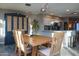 Dining area with a wooden table and view into the kitchen at 1860 S 24Th St, Mesa, AZ 85204