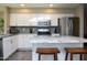 Modern kitchen with white cabinets and granite countertops at 1860 S 24Th St, Mesa, AZ 85204