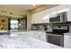 Stainless steel appliances and gray tile backsplash in this kitchen at 1860 S 24Th St, Mesa, AZ 85204