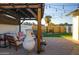 Relaxing patio area with pergola, string lights, and seating at 1860 S 24Th St, Mesa, AZ 85204