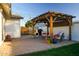 Covered patio features a pergola and comfortable seating area at 1860 S 24Th St, Mesa, AZ 85204