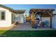 Outdoor patio with pergola, fire pit, and comfortable seating at 1860 S 24Th St, Mesa, AZ 85204