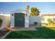 White shed with green door in the backyard at 1860 S 24Th St, Mesa, AZ 85204