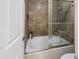 Clean bathroom with tub and shower, and updated tile at 1880 E Morten Ave # 206, Phoenix, AZ 85020