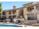 Community pool with surrounding patio furniture at 1880 E Morten Ave # 206, Phoenix, AZ 85020