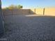 Spacious backyard with gravel and block wall at 19002 N Toledo Ave, Maricopa, AZ 85138