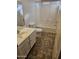 Bathroom with shower/tub combo and updated vanity at 19002 N Toledo Ave, Maricopa, AZ 85138