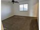 Bright bedroom with carpet flooring and ceiling fan at 19002 N Toledo Ave, Maricopa, AZ 85138