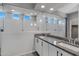 Modern bathroom with double sinks, granite countertop, and a walk-in shower at 19137 W Jackson St, Buckeye, AZ 85326