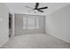 Well-lit bedroom with carpeted floor and ceiling fan at 19137 W Jackson St, Buckeye, AZ 85326