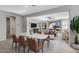 Dining room with marble table and view into the living room at 19137 W Jackson St, Buckeye, AZ 85326