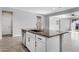 Modern kitchen island with granite countertop and stainless steel dishwasher at 19137 W Jackson St, Buckeye, AZ 85326