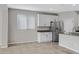 Modern kitchen with white cabinets and stainless steel refrigerator at 19137 W Jackson St, Buckeye, AZ 85326