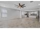 Open concept living room with kitchen view and tile floors at 19137 W Jackson St, Buckeye, AZ 85326