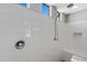 Walk-in shower with tiled walls and built-in seat at 19137 W Jackson St, Buckeye, AZ 85326