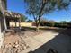 Backyard with grassy area, patio, and gravel landscaping at 20457 N 80Th Dr, Peoria, AZ 85382