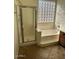 Bathroom with shower, bathtub, and block window at 20457 N 80Th Dr, Peoria, AZ 85382